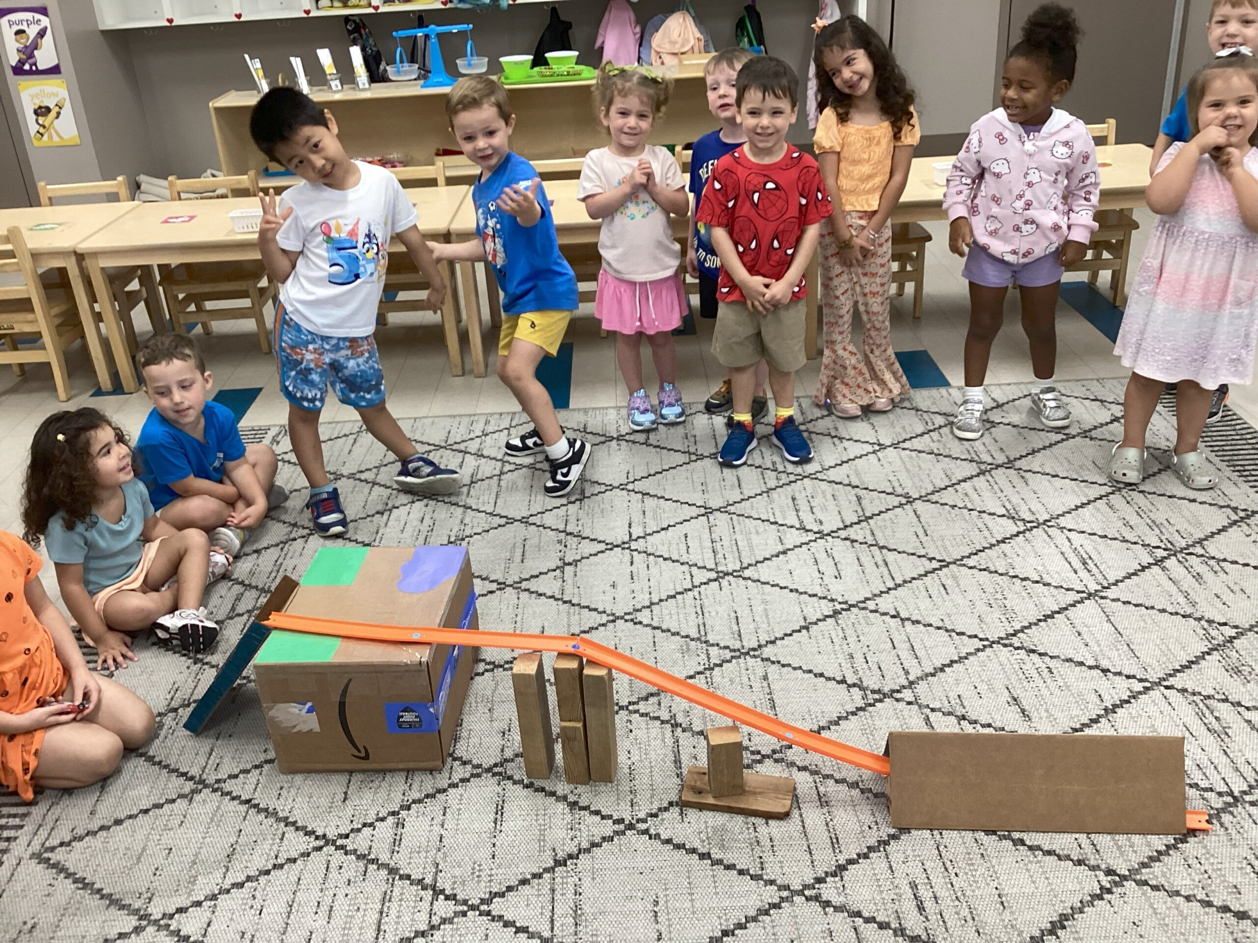 Group of preschoolers problem solving together.